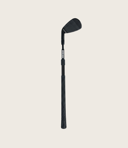 Studio shot of a black, toddler, adjustable golf wedge club, on a light off white background. Mini Hoshi branded club. 